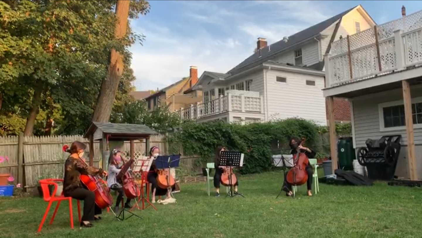 Cello ensemble performing outdoors